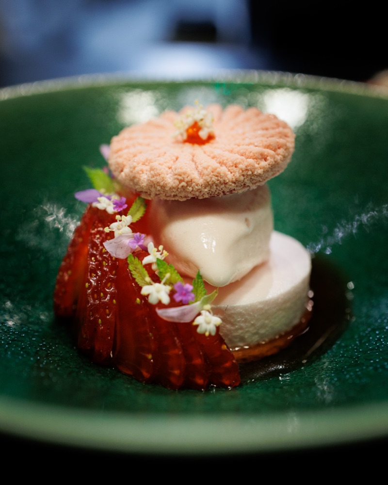 Strawberry dessert in a green bowl